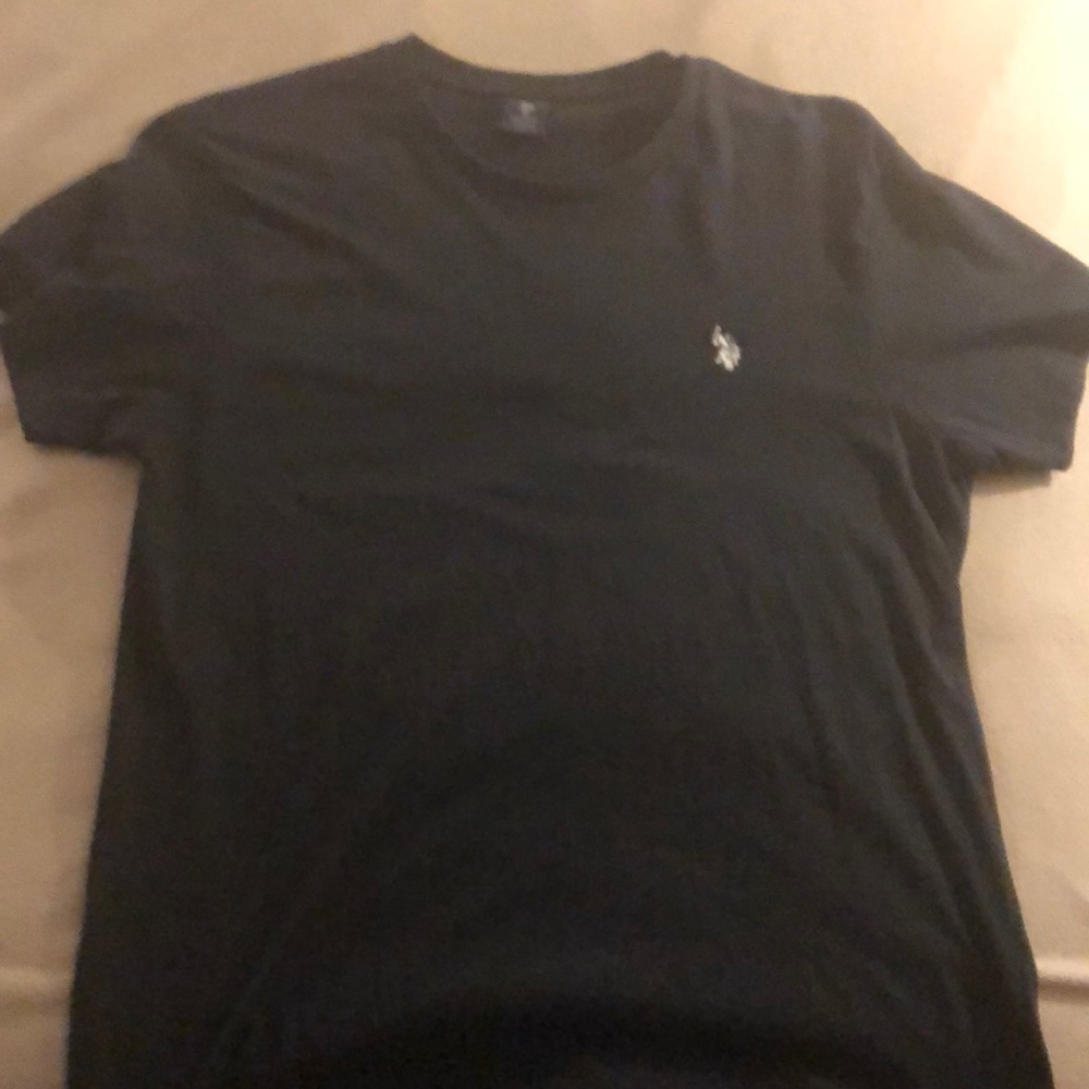 Black Polo T-Shirt with White Logo. Size Medium